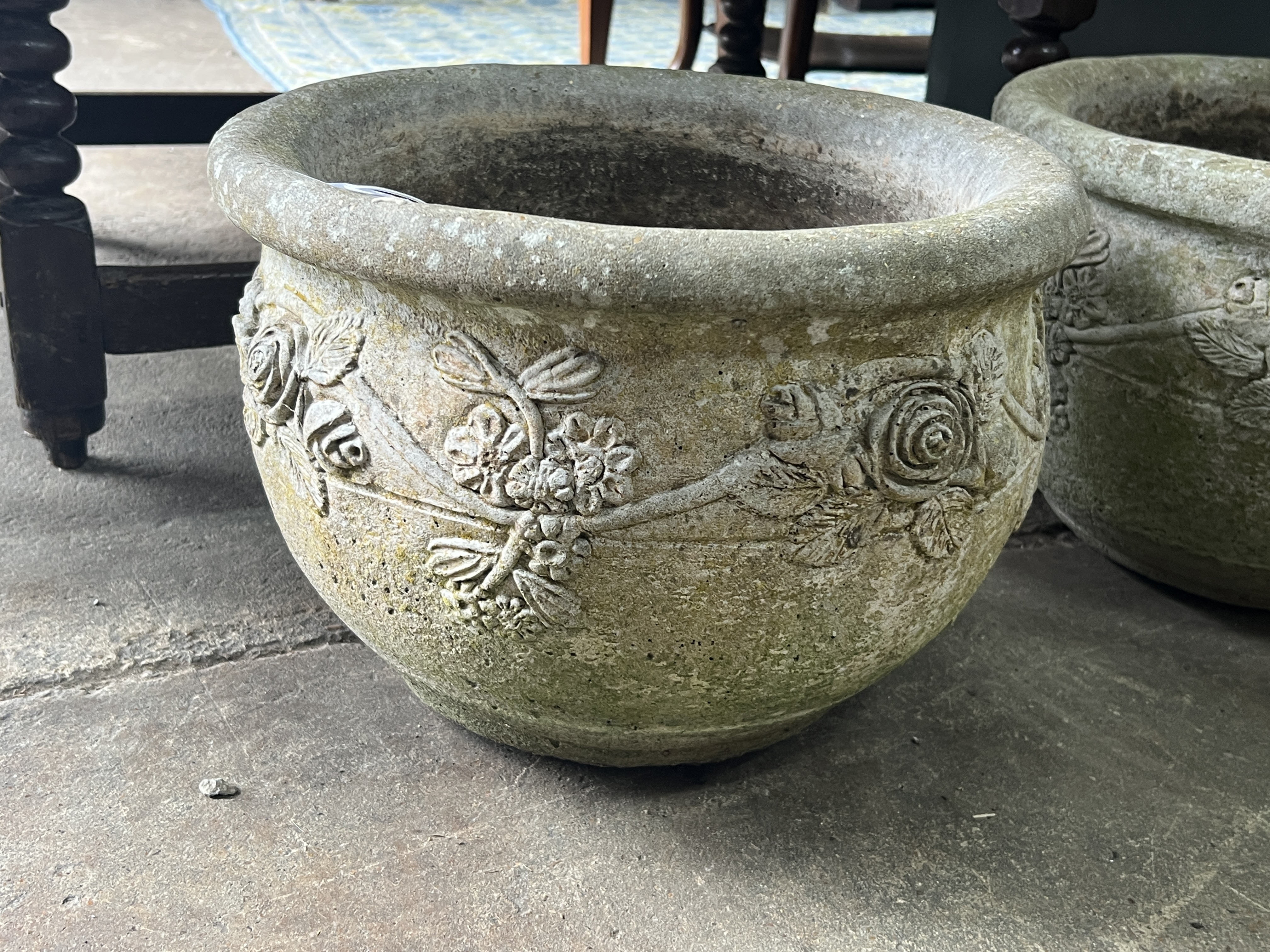 A pair of circular reconstituted stone garden planters, diameter 37cm, height 26cm